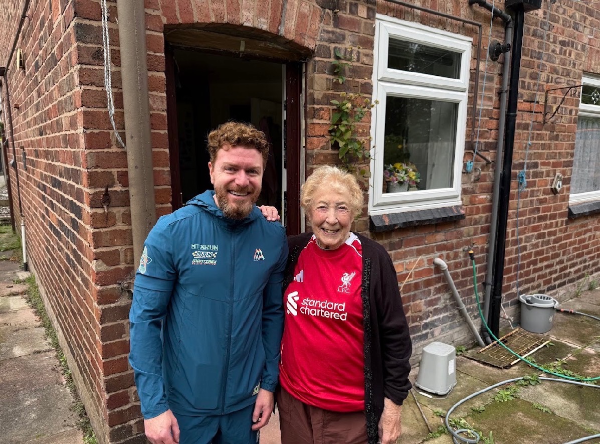 Phil Brookes-Lennon with the resident he helped on Tollerton Road